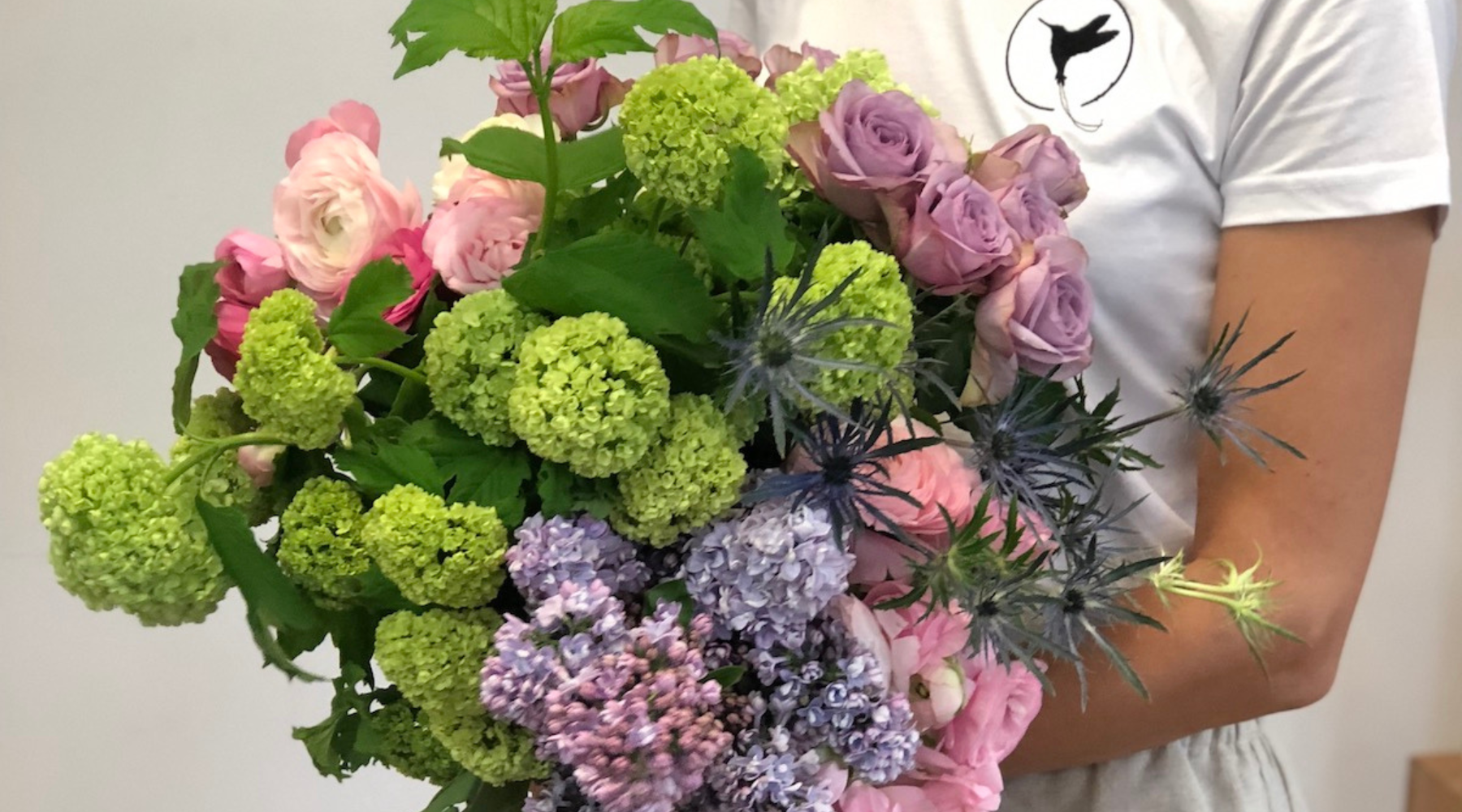 beija flor darwin spring seasons viburnum snowball with lilacs, garden roses, sea holly and ranunculus bouquet