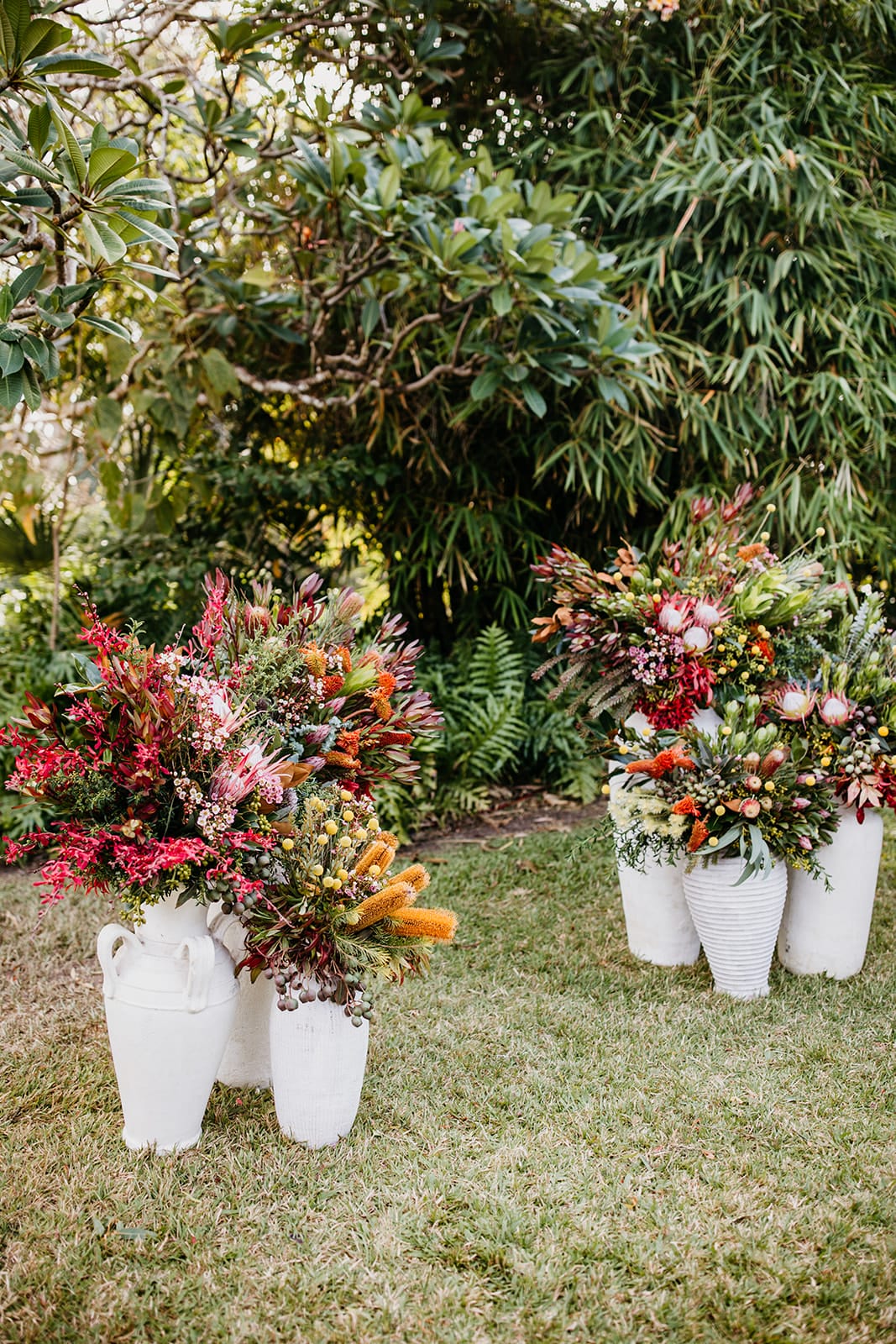 Decorative floral arrangements in white pots at Darwin Botanic Gardens