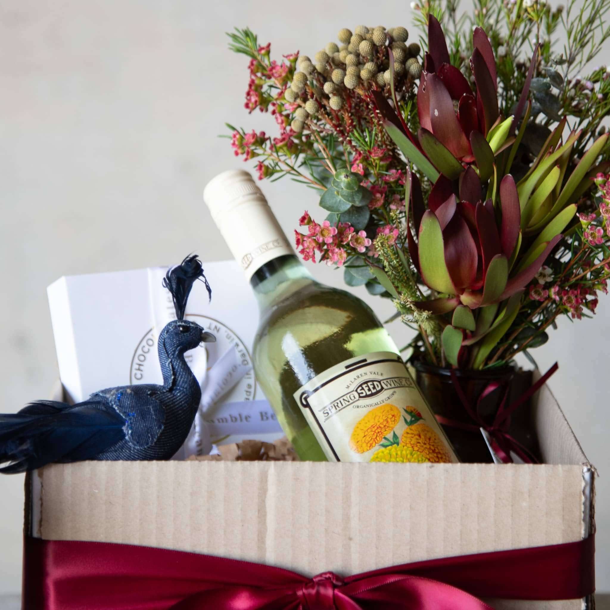 Beija Flor Christmas Humper Gift with Spring Seed wine, Flower Jar, Chocolates, and Festive Peacock