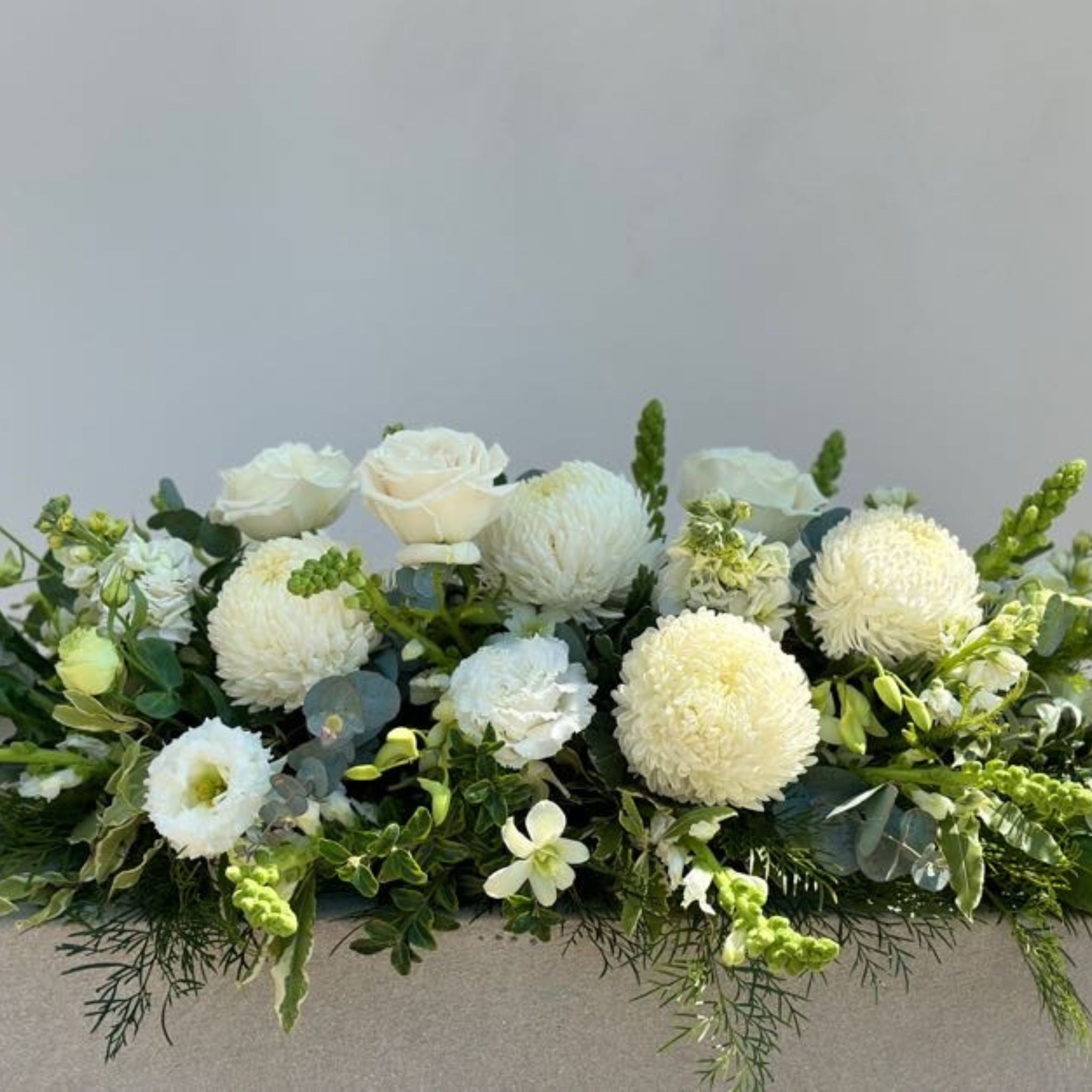 Beija Flor Darwin Funeral Flower White Casket Spray in Small