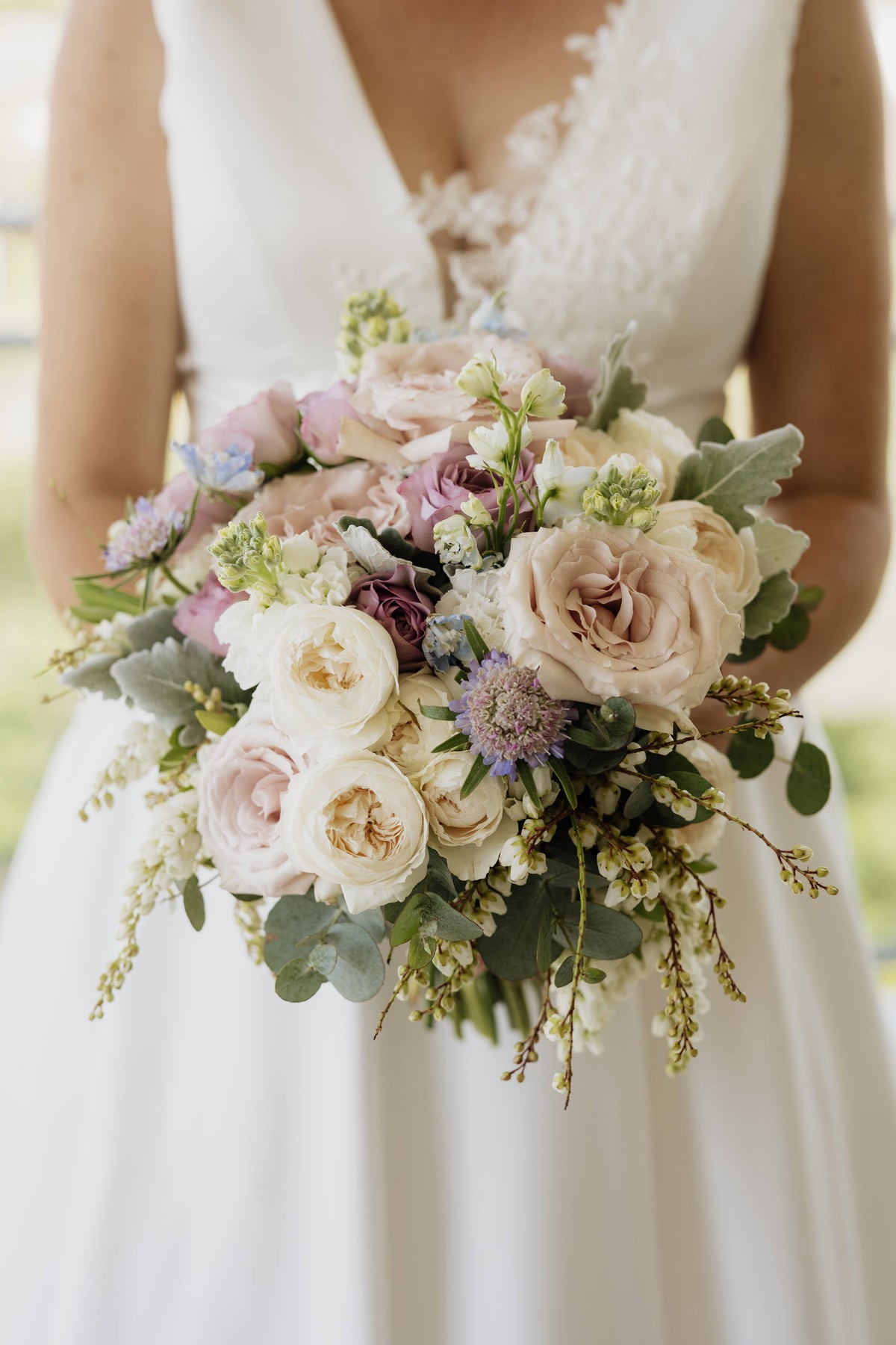Bride holding a bouquet higlighting the dress - Rebecca and Nathan, Beija Flor Real Wedding