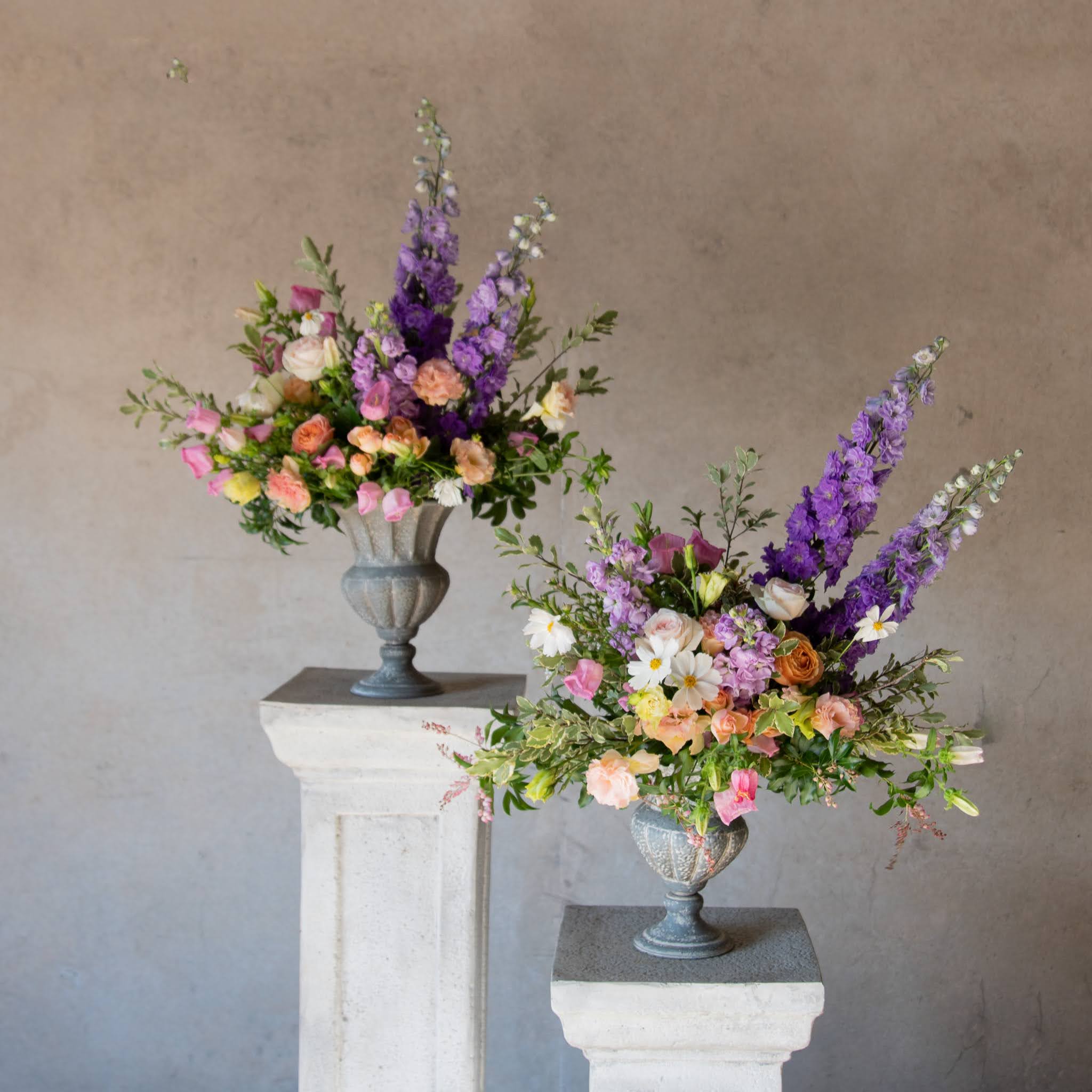 Urns filled with garden style floral