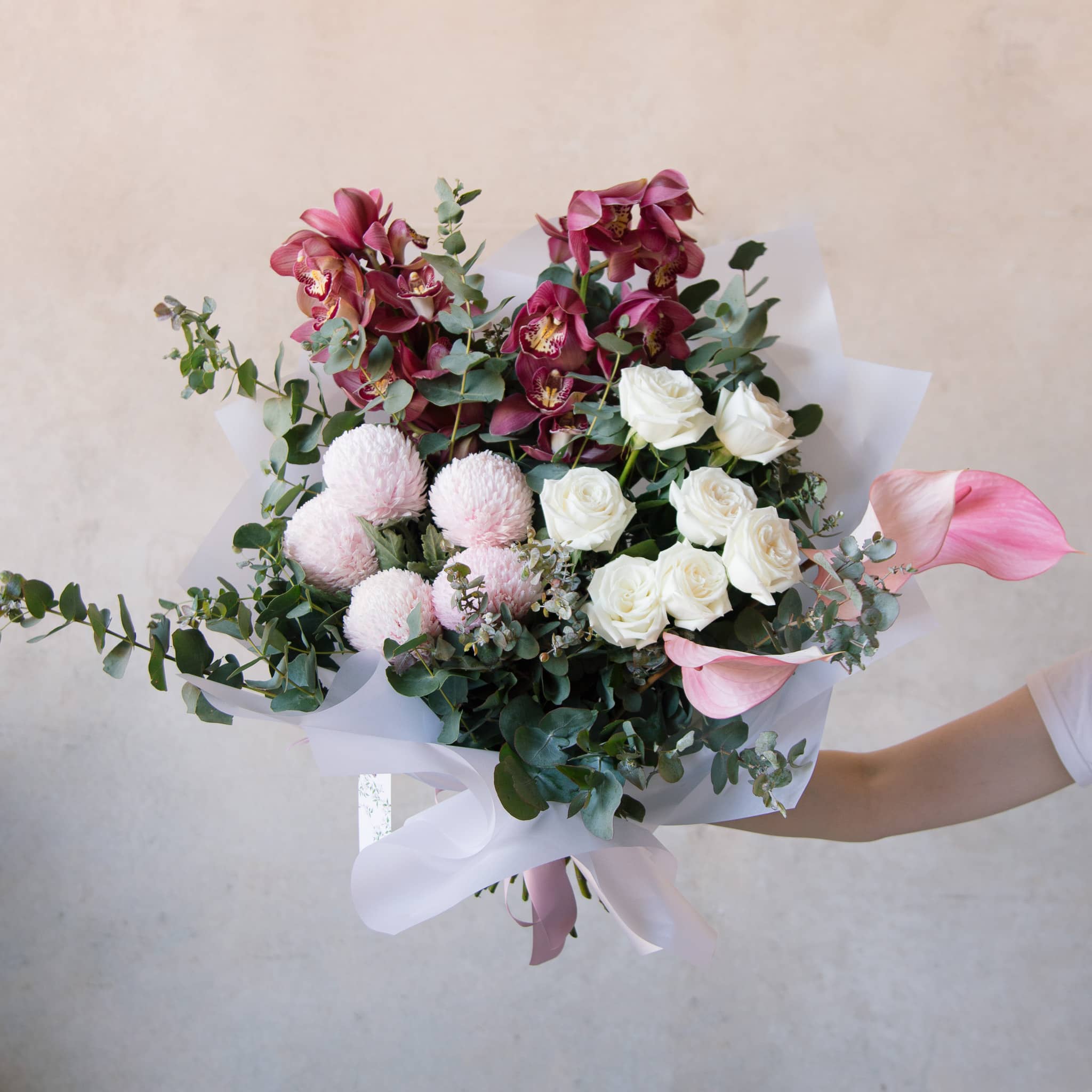 Large bouquet of orchids and roses