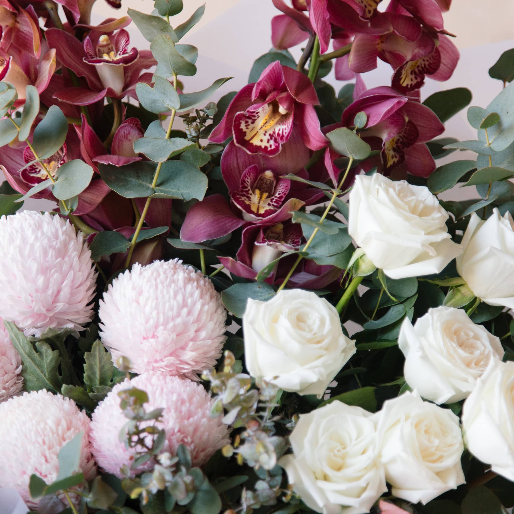 bouquet of cymbidium orchids with white roses 