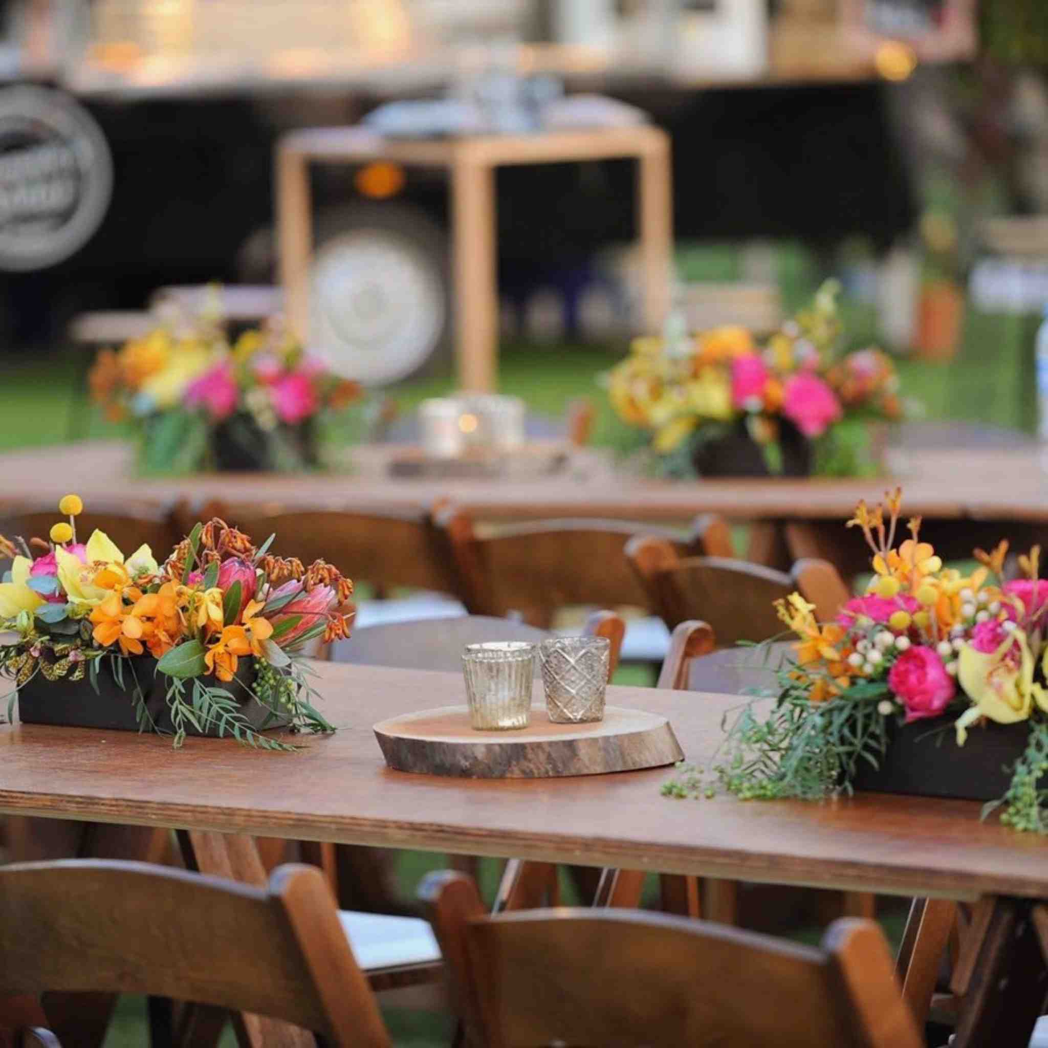 Beija Flor - Darwin wedding & event hire - Timber Trough Colourful Floral Arrangement