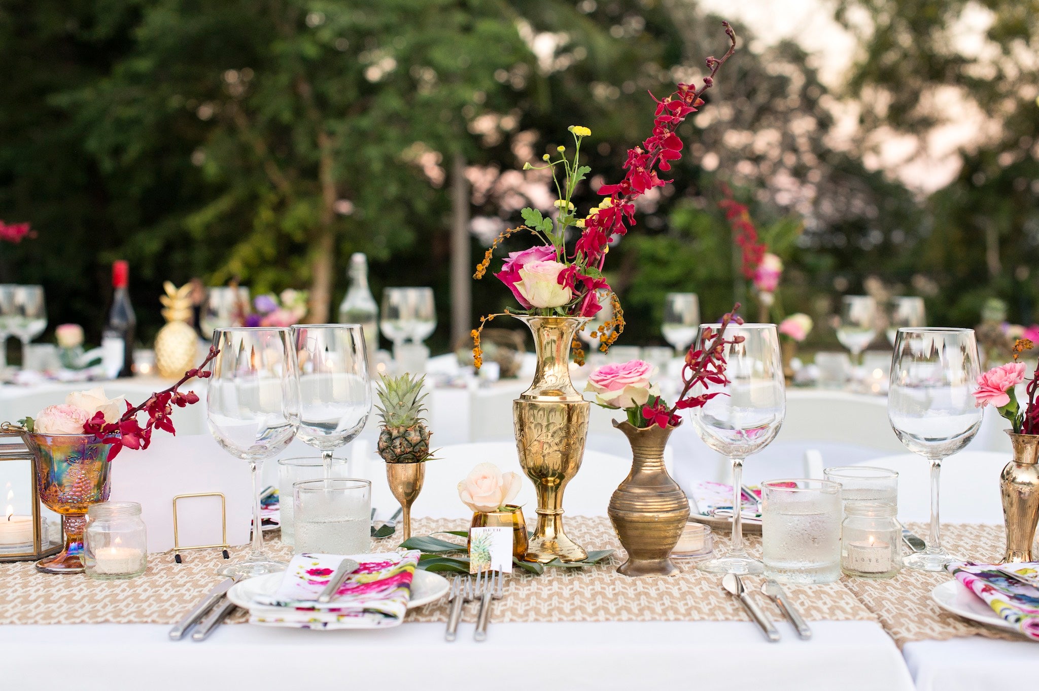 brass vessels with colourful flowers at an outdoor Darwin wedding