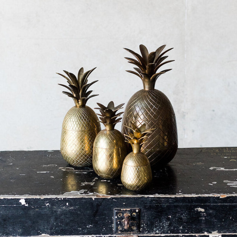 Brass pineapples decor hire