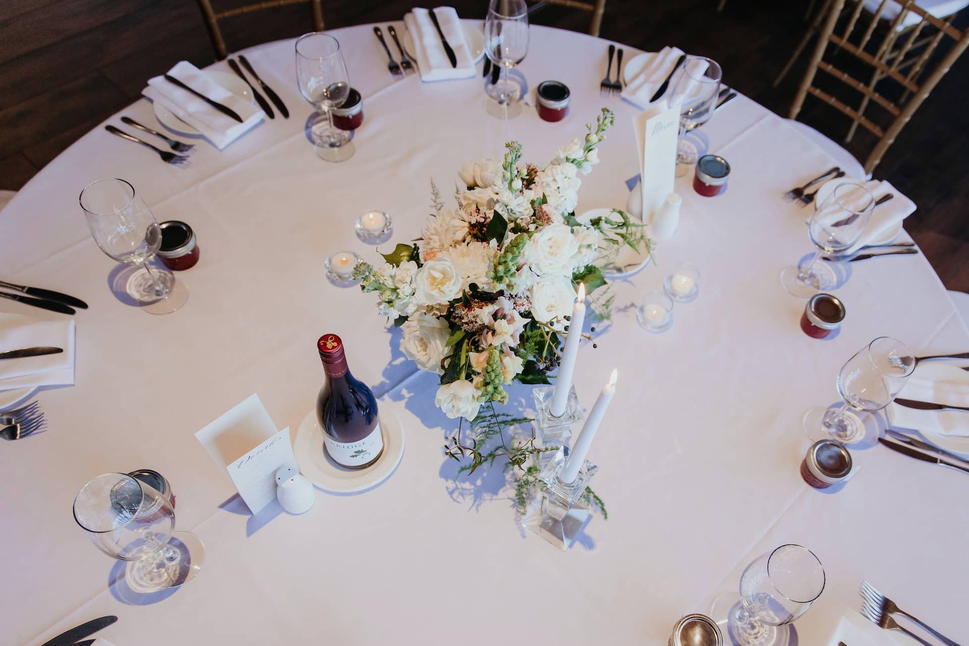 table centrepiece with flowers and crystal candlesticks