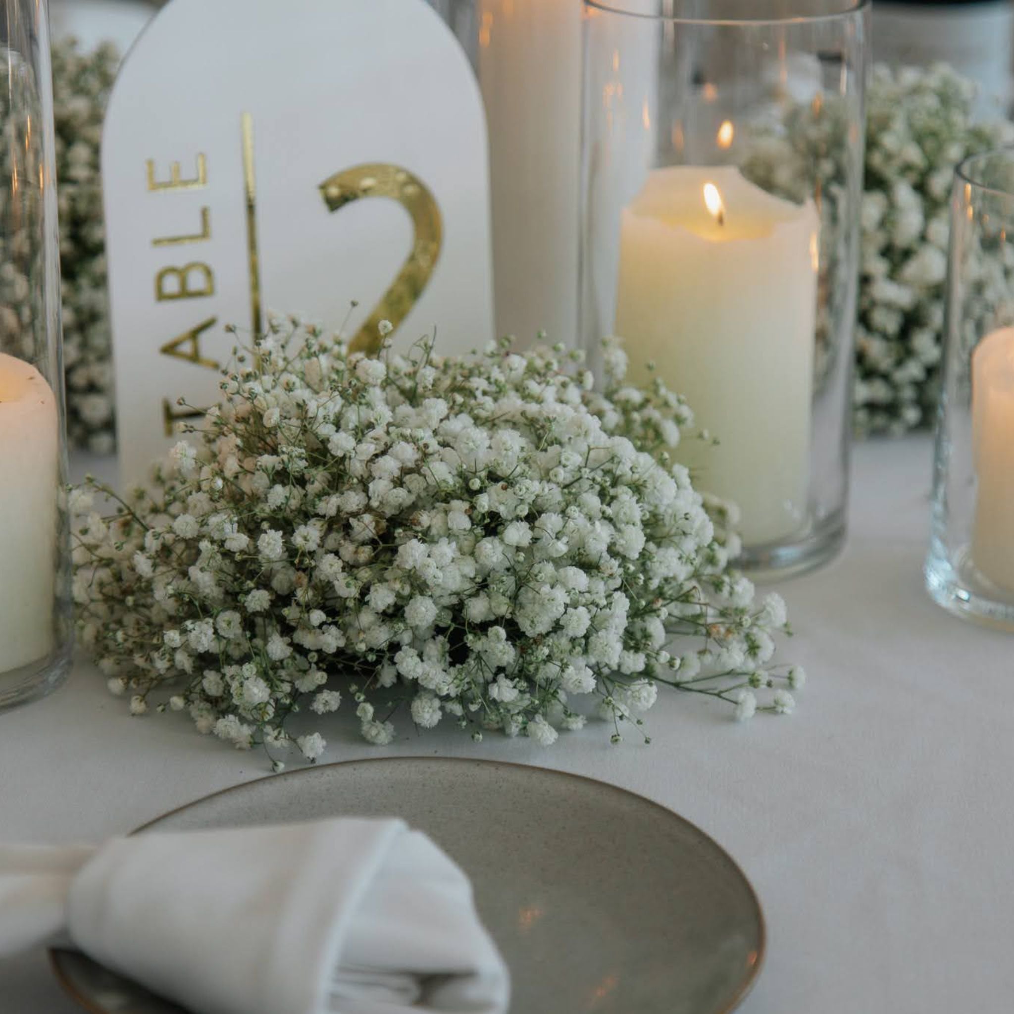 Wedding table with gypsophila and candlelight