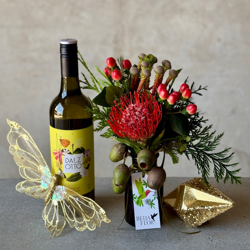 christmas gift box with festive posy jar, wine and gold ornaments