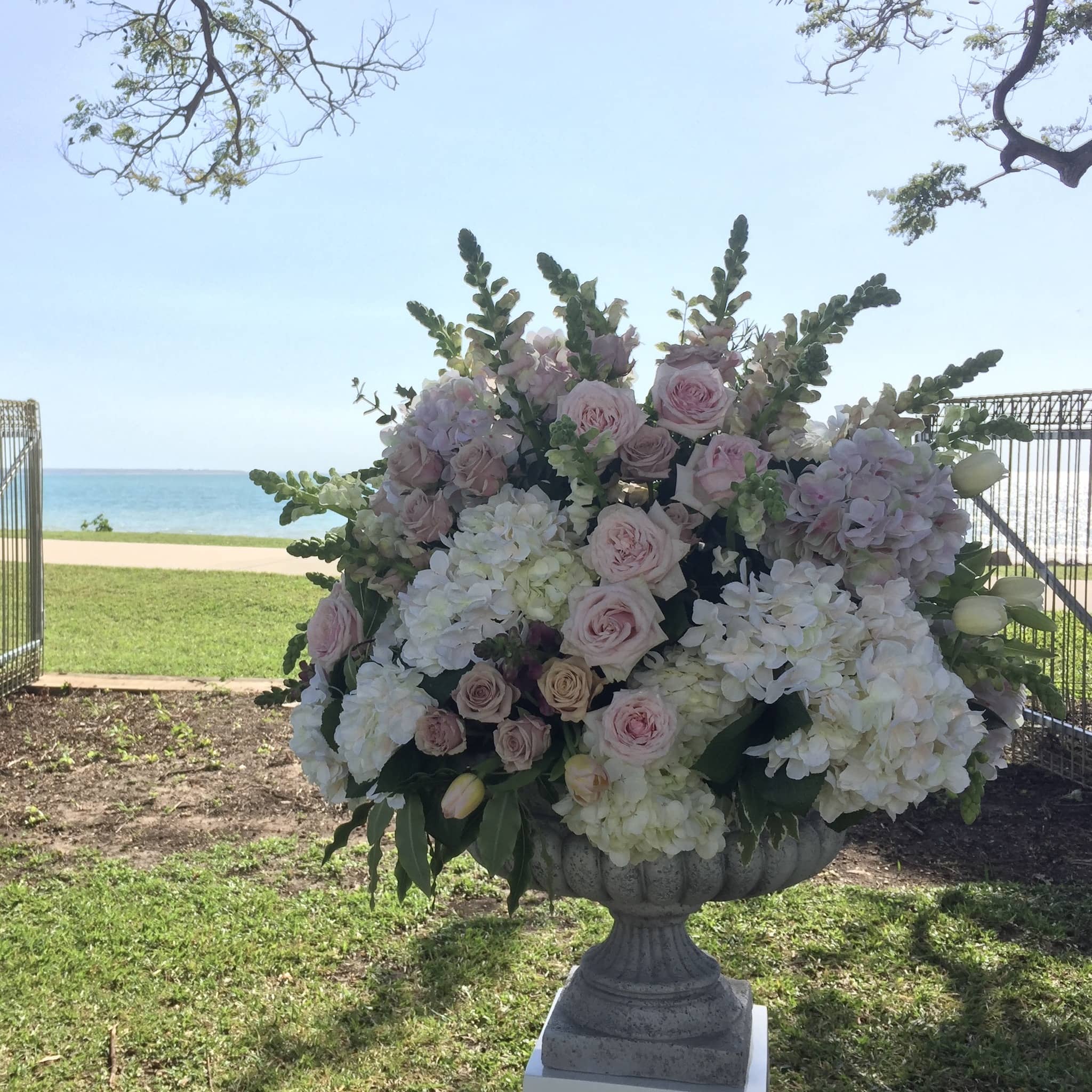 Large urn filled with flowers at Mindil Beach