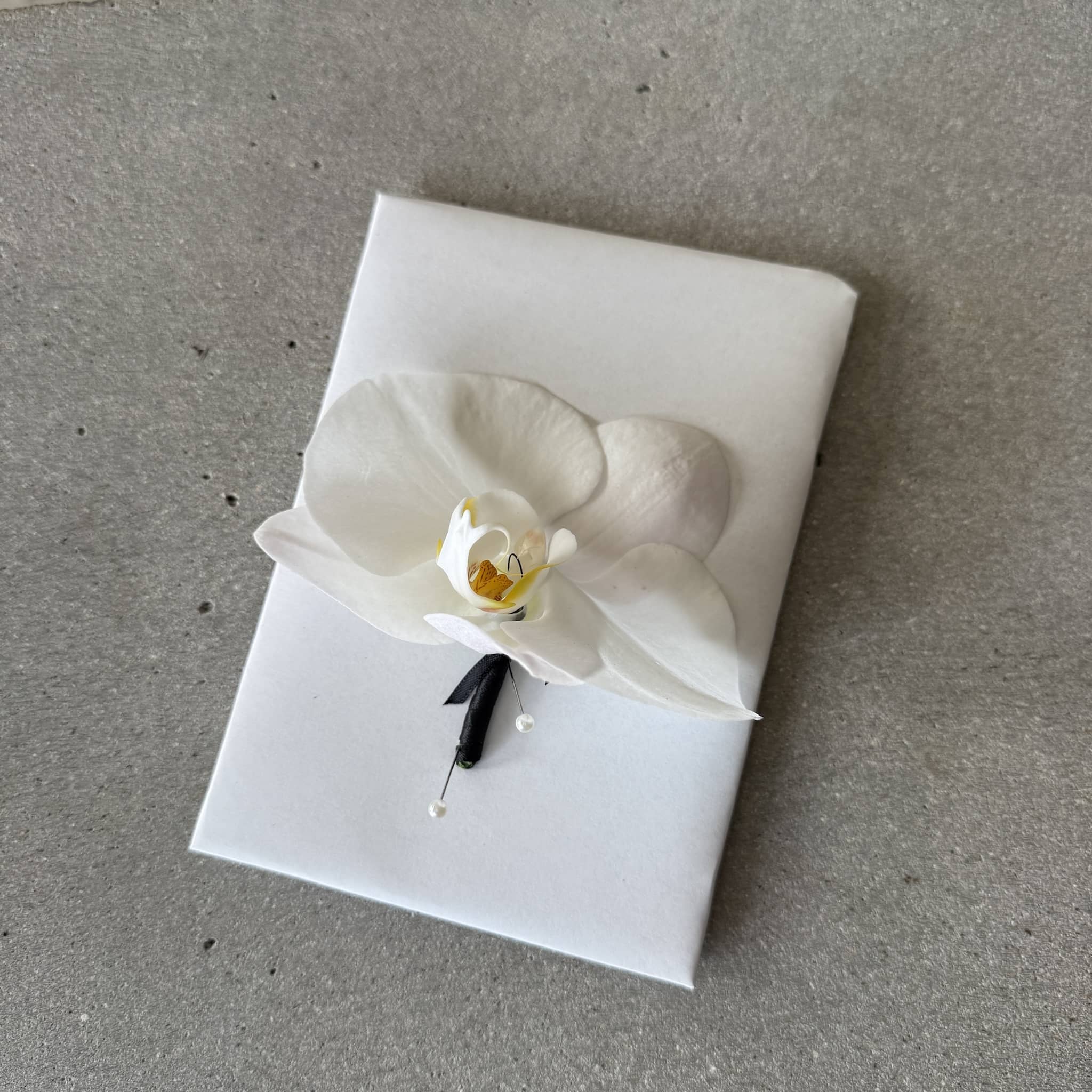White orchid buttonhole for formals