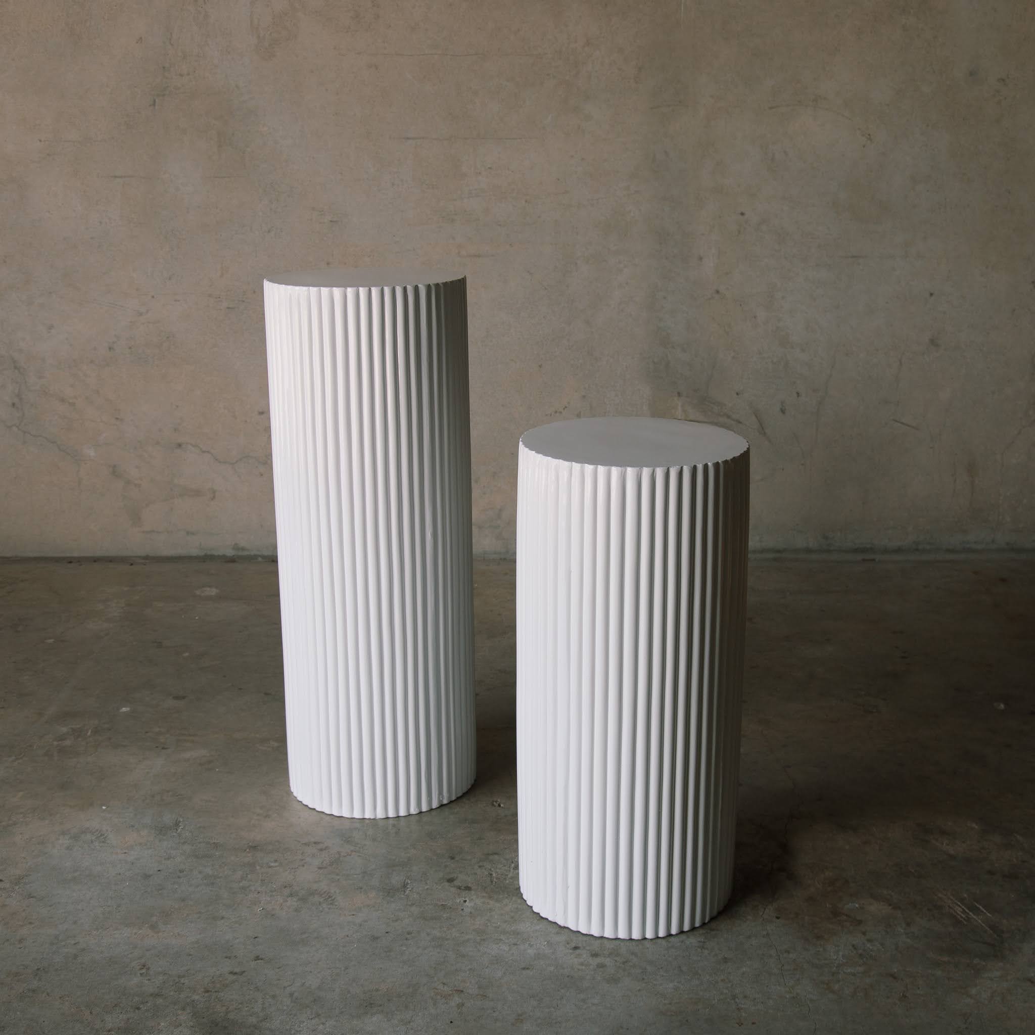 pair of white ripple pillars