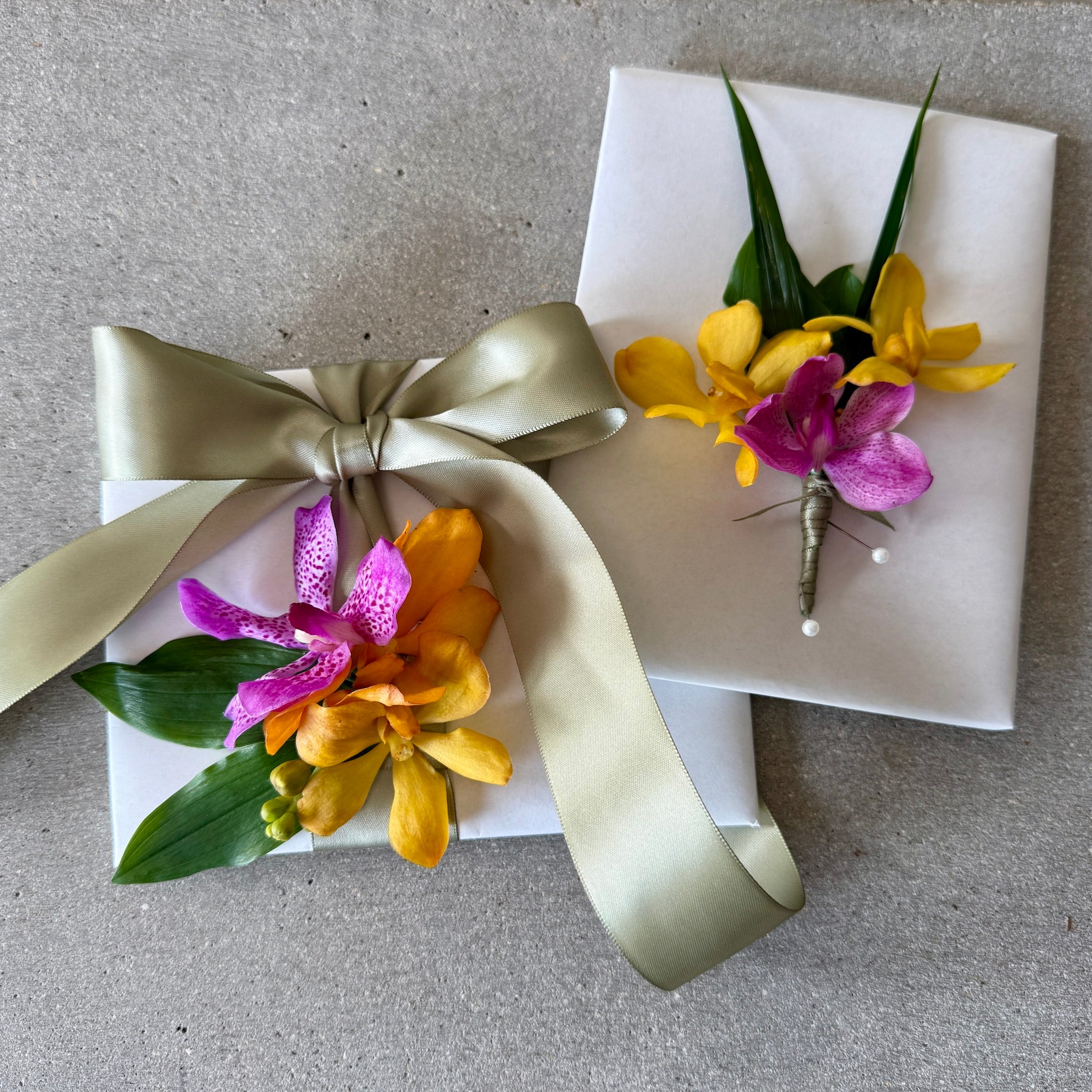 Tropical corsage and matching buttonhole in vibrant colours