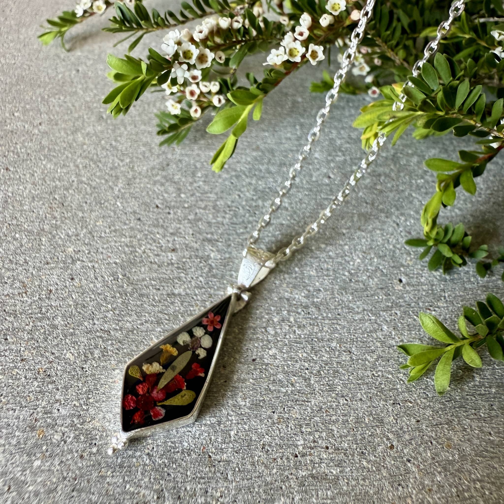 Wildflower jewellery silver pendant with pressed flowers set in resin