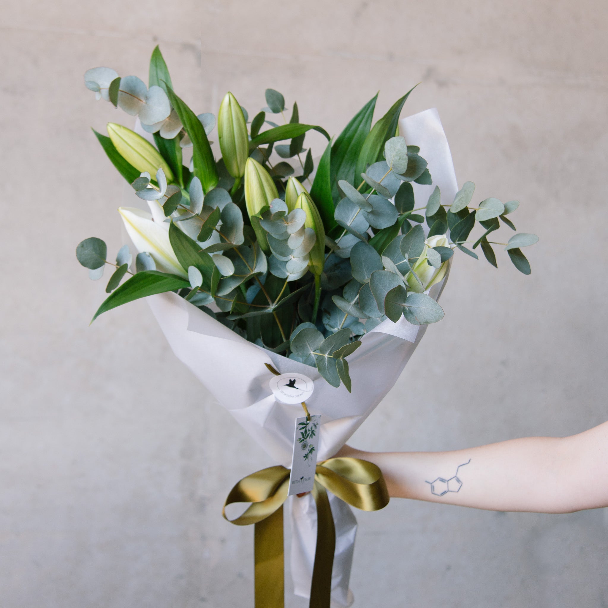 Bouquet of white oriental lilies with eucalyptus