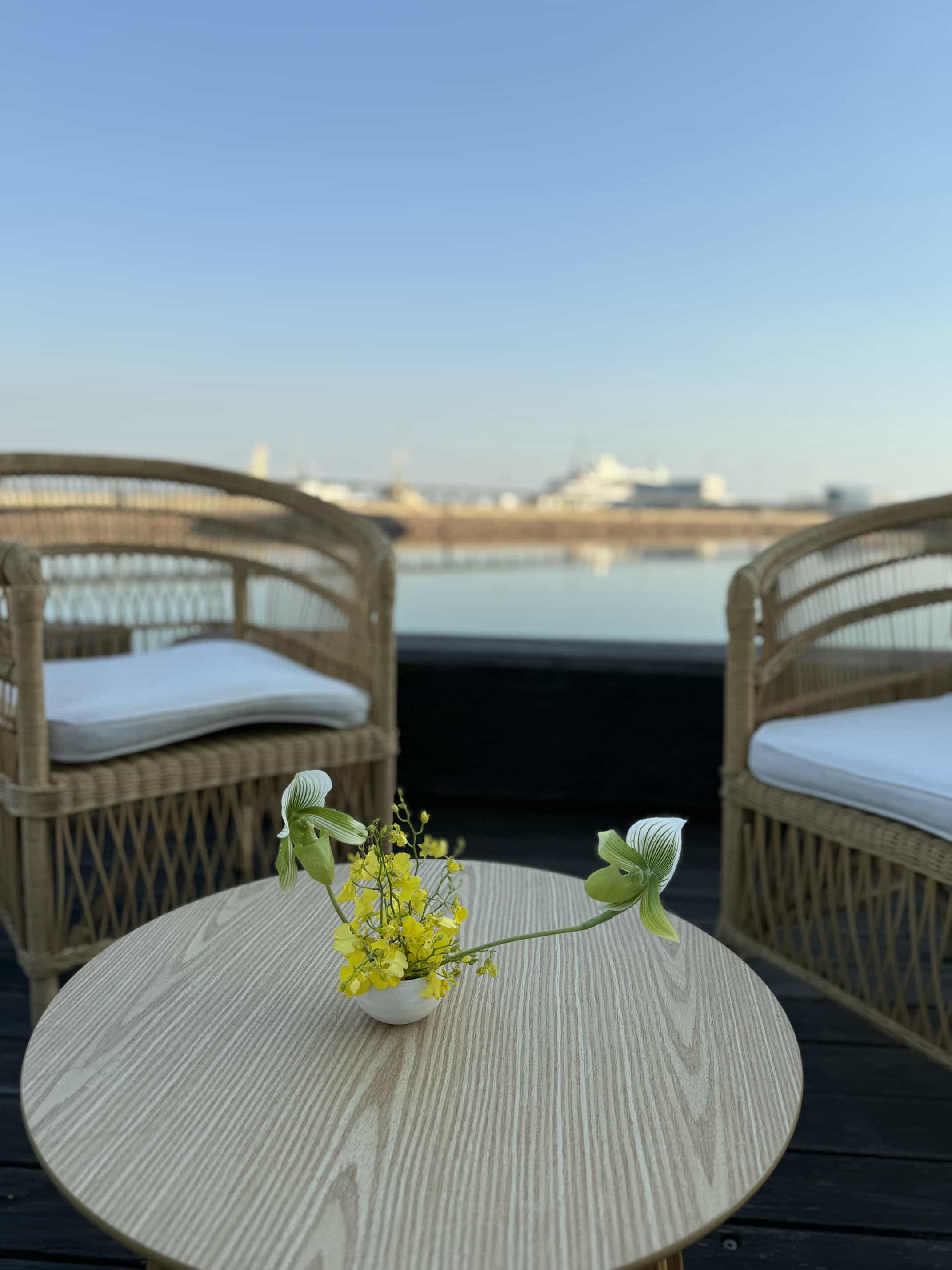 beija flor paspaley bar arrangement yellow florals white vase