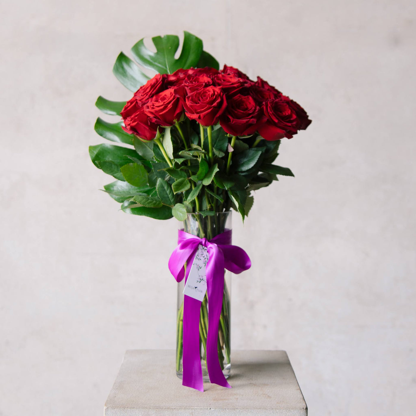Beija Flor Valentines Day Two Dozen Red Rose Vase Tied in Purple Ribbon