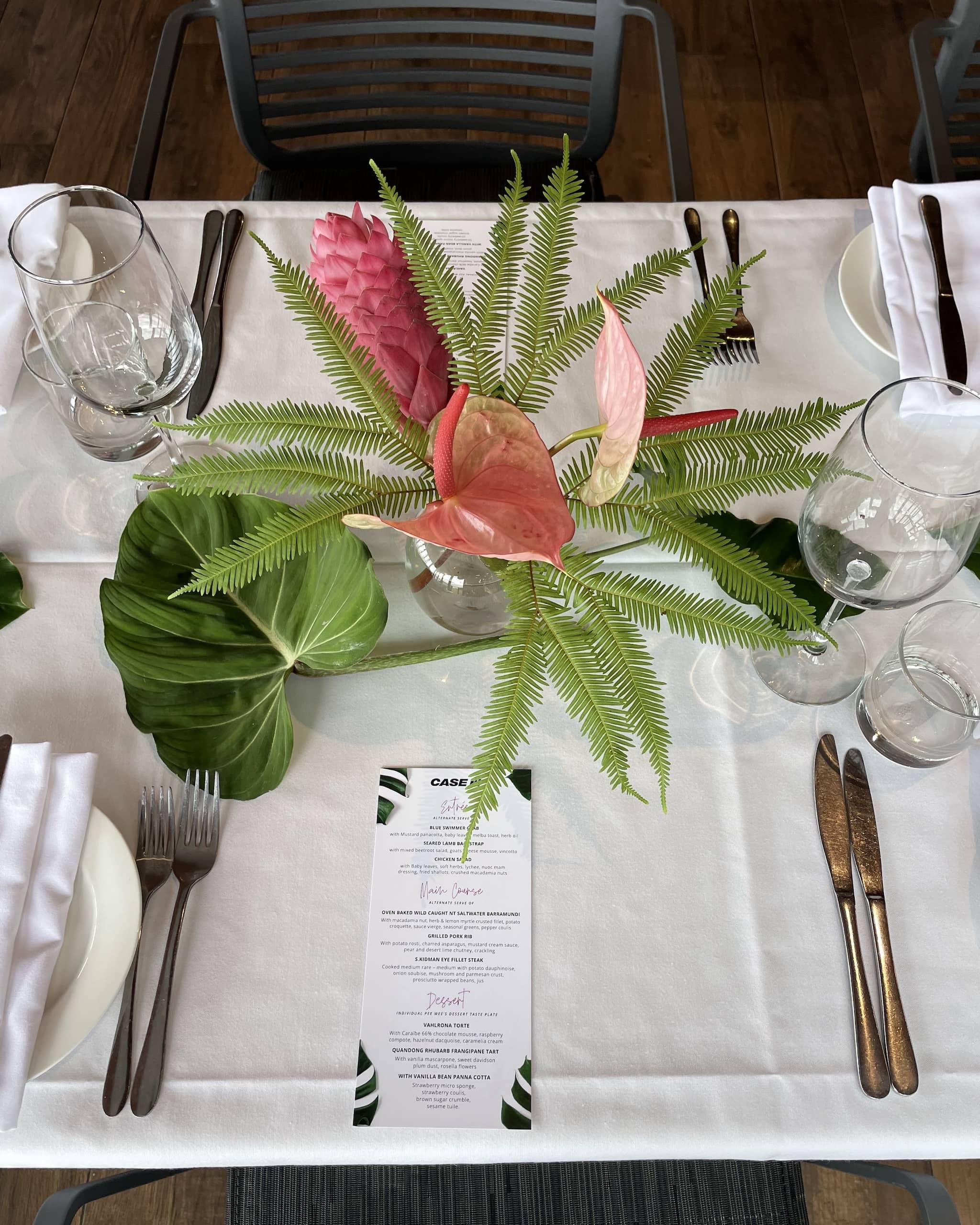 petite tropical flower centrepiece in glass bubble vase for an event at Pee Wees by the Point in Darwin