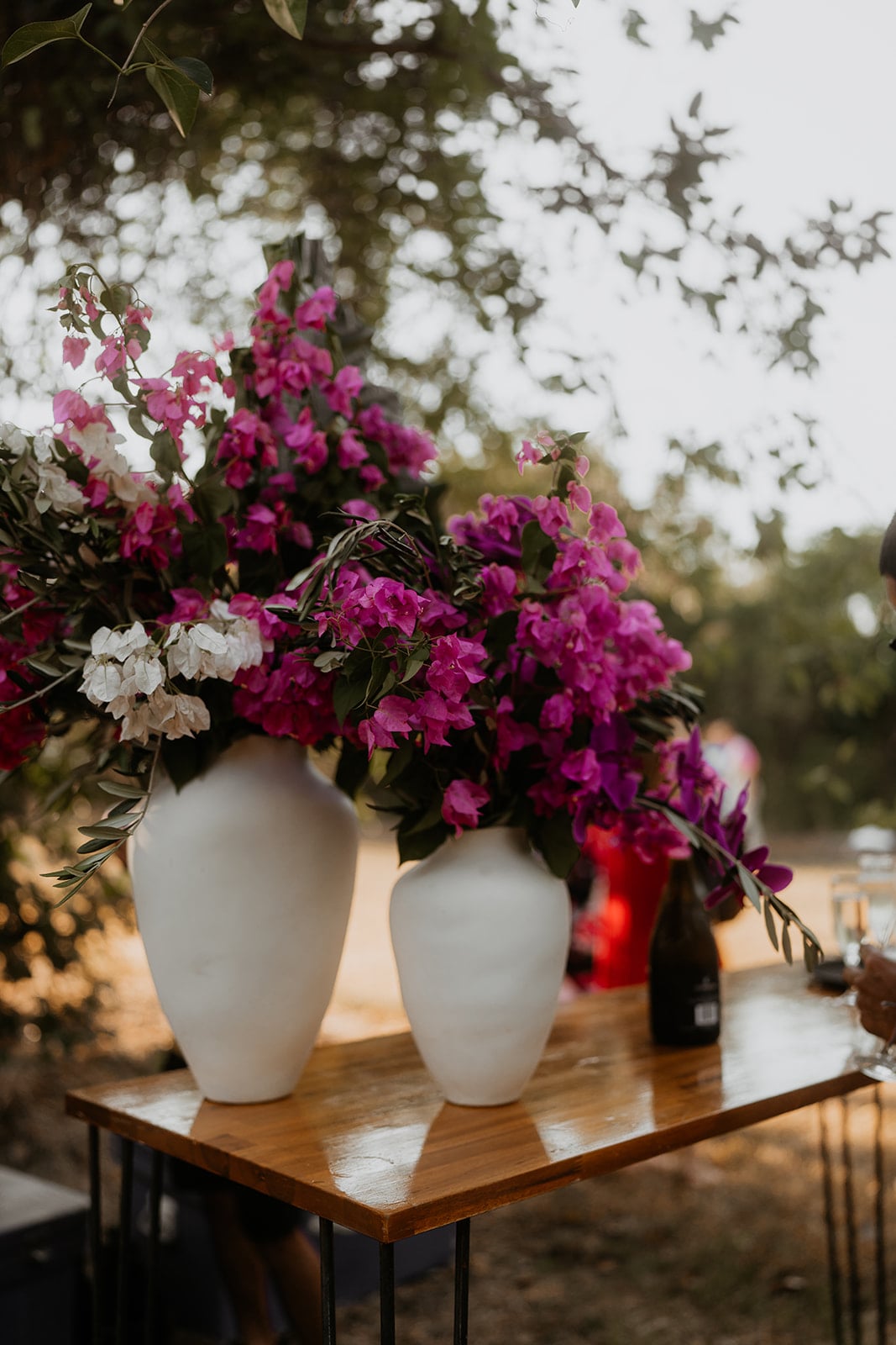 classic white vases of bougainvillea for an outdoor Darwin wedding