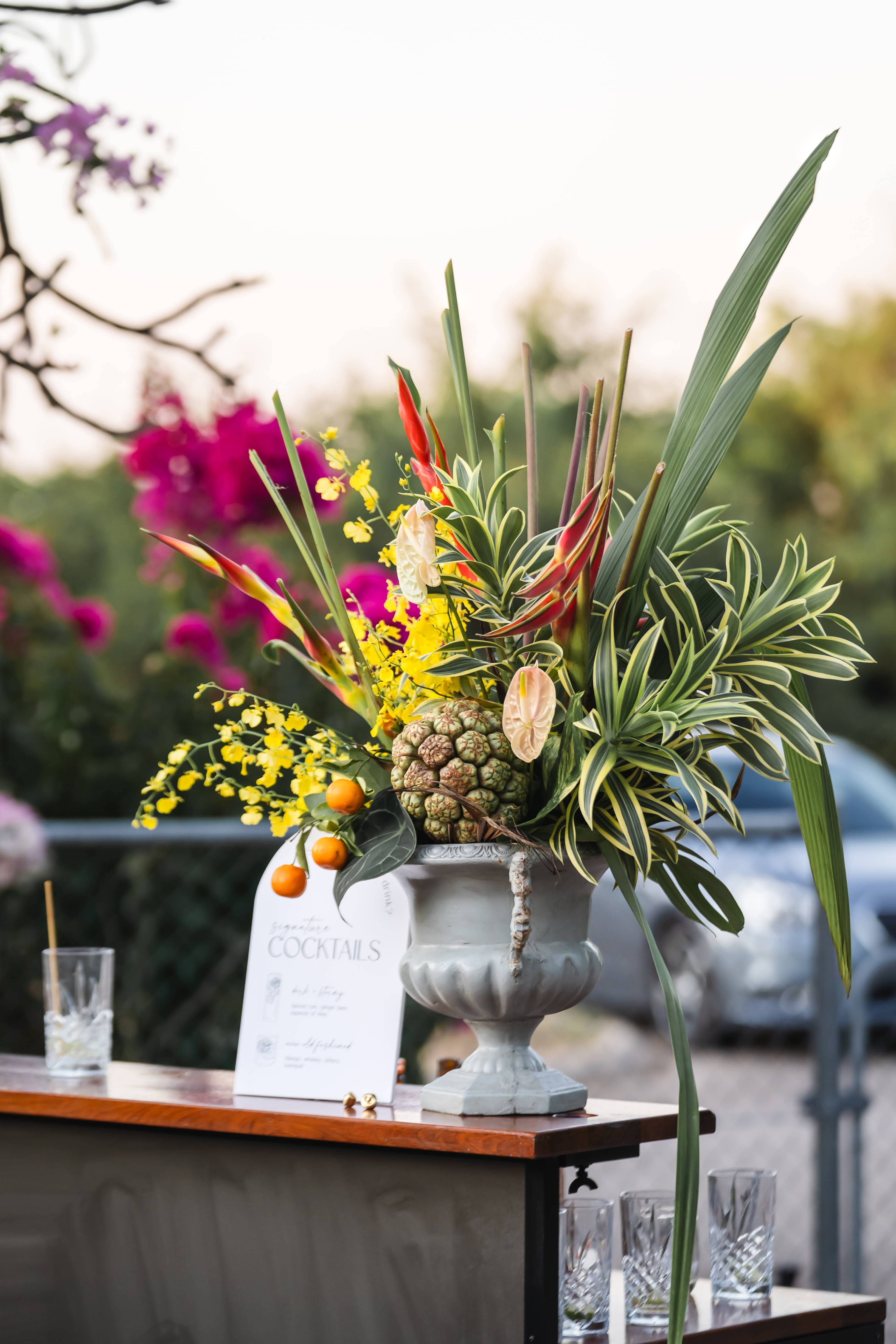 Kayla and Russell Beija Flor Real Wedding Wedding table setting with tropical flowers and candles
