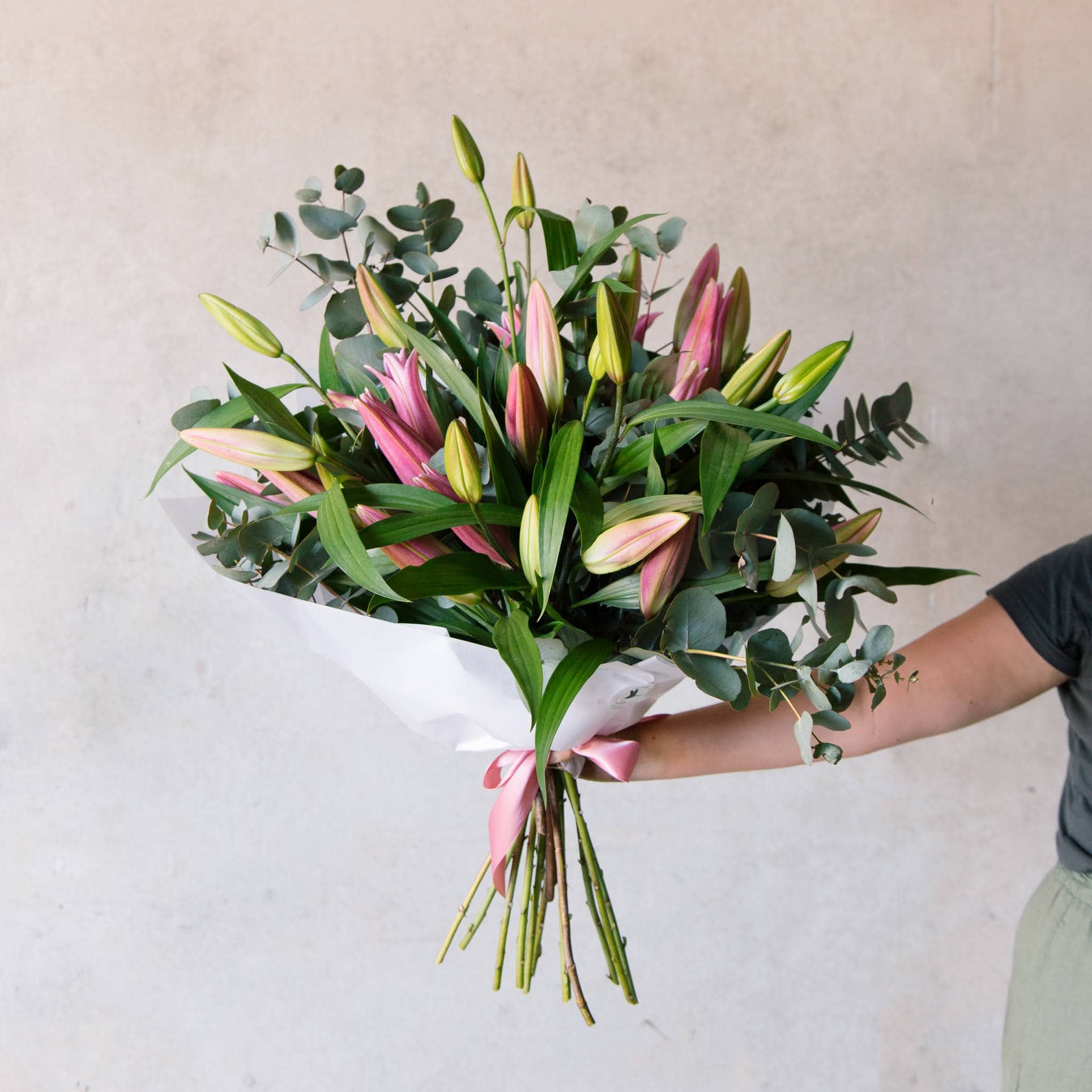 Bouquet of pink lilies with eucalyptus