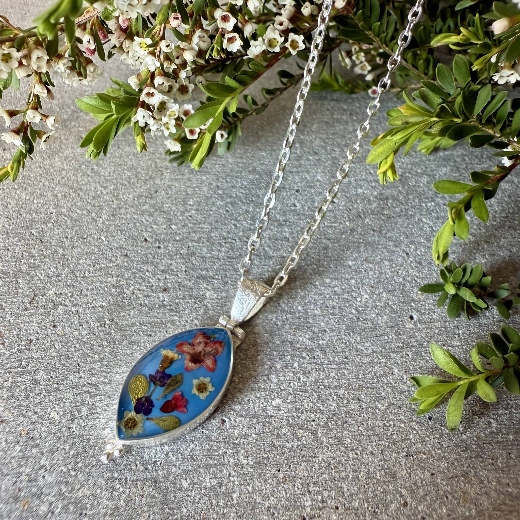 Wildflower jewellery with flowers pressed in resin